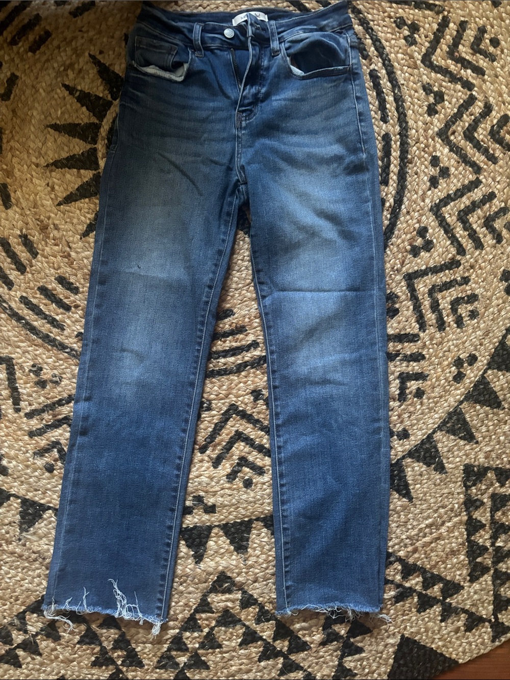 stretchy bootcut jeans distressed at the bottom